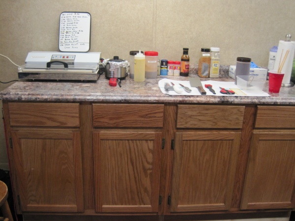 I added the kitchen counter in the garage area for storage and prep area.  I raised the counter to my desired height.