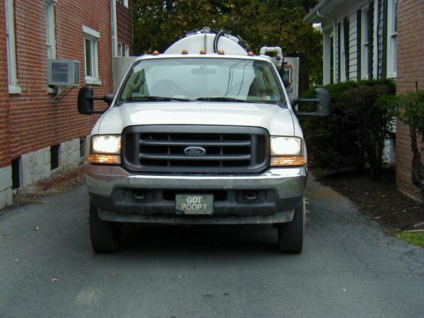 I couldn't resist taking a picture of this septic tank ("honeydipper") cleaner's truck as it sat in an alley at the Fall Foliage Festival in Bedford, 