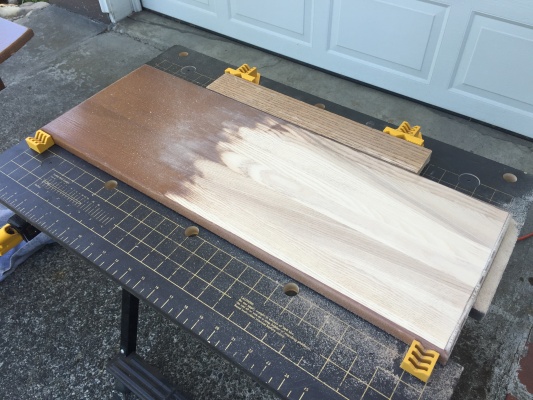 I decided to experiment on the back of the center leaf. The belt sander worked really well with getting down to bare wood. I used 220 grit sandpaper o