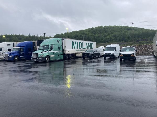 In the Canadian Maritimes RV can stay in some truck stops. This one even includes an RV dump station. Has a great restaurant, no charge. We were very 