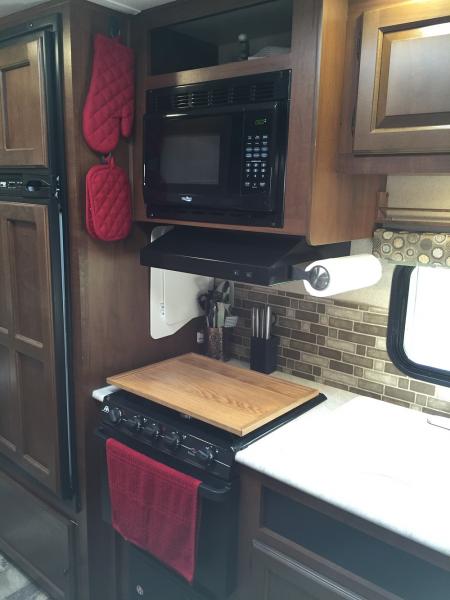 In this photo you can see we use Command Hooks for the pot holders and as storage for the sink covers along the side wall next to the stove. I would l