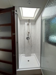 Incredible Corian lined 32x32 shower in dry bath.