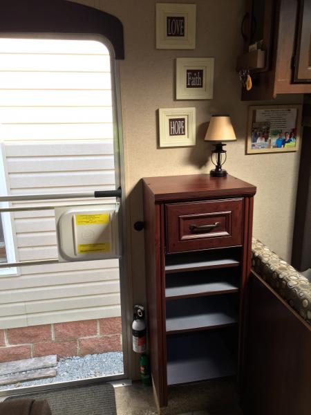 Installed a Closetmaid cabinet to store our shoes. If you look to the left of the cabinet you will see a dimmer switch, which is connected to the lamp