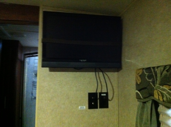 Installed Bedroom tv in travel position strapped to the wall