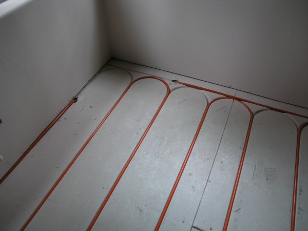 just a couple shots of the floor heat, 7 zones of low temp. heat, product called Warm-Board, it is 1 1/8" plywood covered with aluminum to conduct hea