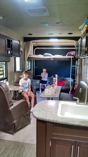 Kiddos getting settled in on maiden voyage. So nice to be able to leave beds made/down in the rear and still enjoy the couch and chairs in the main ar