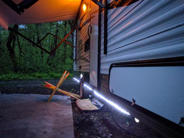 LED under camper lights.  Simple Christmas style lights that are plugged into the outside 120 volt outlet.