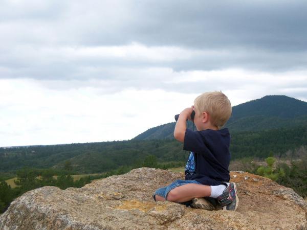 Liam scoping out helicopters at Fort Carson, CO - July 2010