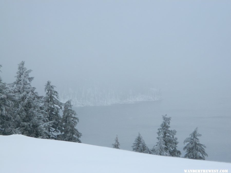 Limited view of Crater Lake and Wizard Island.