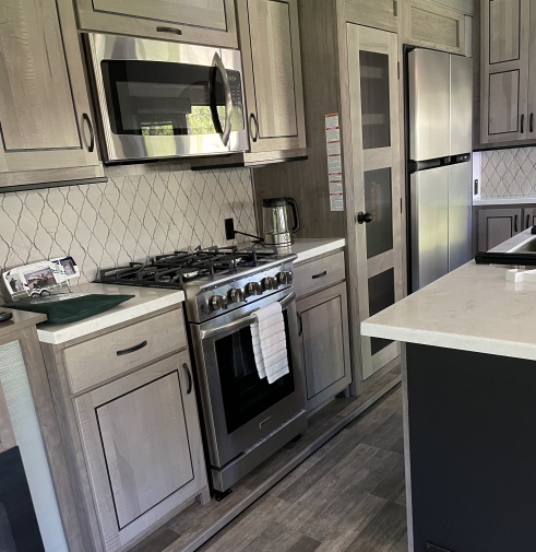 Lovely kitchen with full-size oven and lots of counter, storage space.