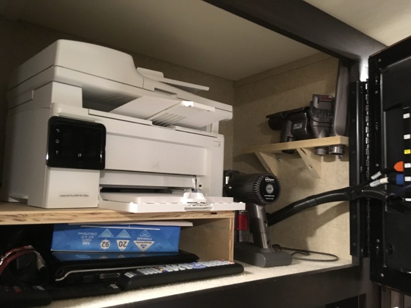 Made shelf for our printer and Dyson vac behind the bedroom tv