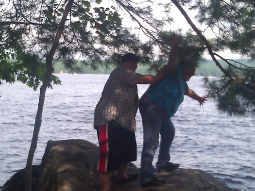 Michelle and our son josh threating to jump off the Rock into the water? Go ahead I dare you too 😁