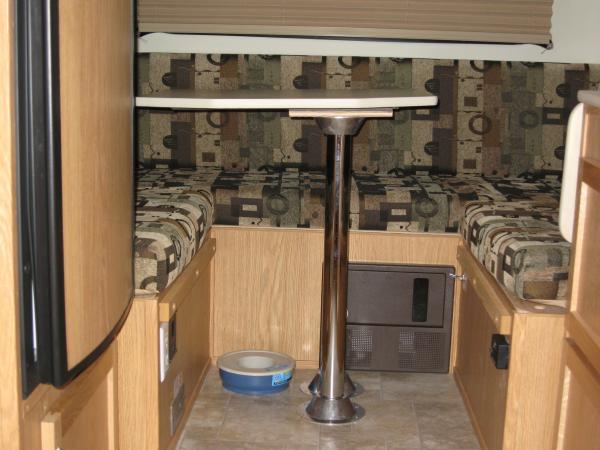 More Room Driver Side with the front dinette table in the rear dinette