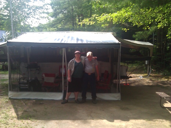 My son and I Stand outside our screened Room.