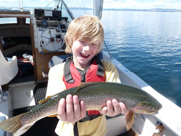 My son expressing how fun catch & release can be of native cutthroat trout on Yellowstone Lake.  We had a really fun day!