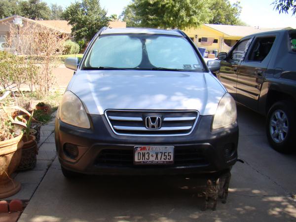 Old nasty looking headlights on 2005 Honda CRV.