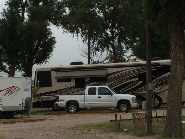 Our next door neighbor puts our baby to shame.  (Our truck-pictured-broke down and we had to stay extra days.  Fuel pump burnt up due to faulty gas ga