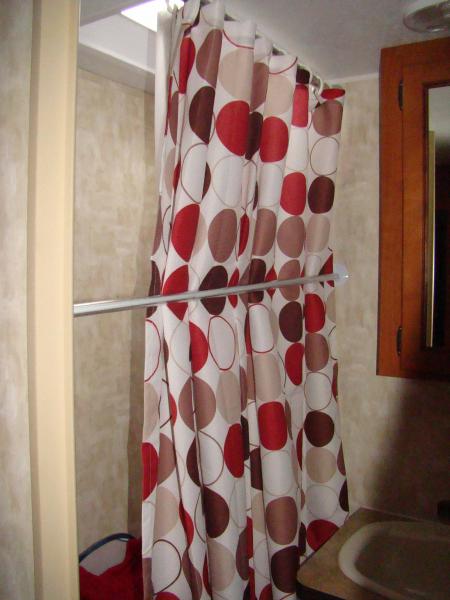 our shower curtain.. added a push rod to keep the shower curtain further out while taking a shower.