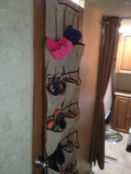 Over the door shoe rack for all the kids shoes.