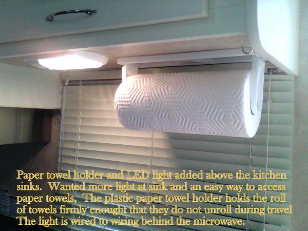 paper towel holder & light I added to cabinet above the sink for more light and convenience of using paper towels.