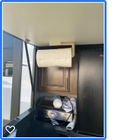 Paper towel rack inside outside kitchen, on door.