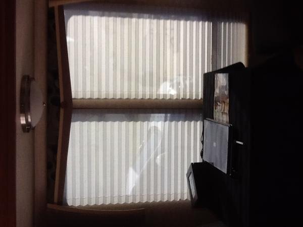 Picture is sideways...sorry
Replaced fabric drapes with day/ night shades with valances in the salon area