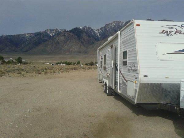 Pit stop in Olancha, Sierra Nevadas behind.