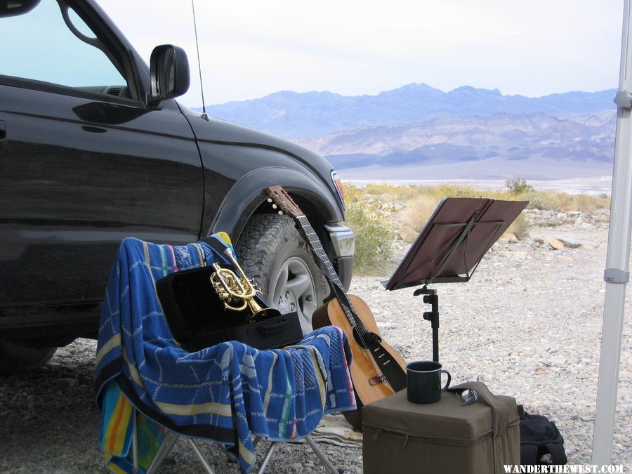 Practicing the horn and guitar in remote canyon