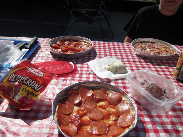 Preparing pizza's for some Dutch Oven cooking