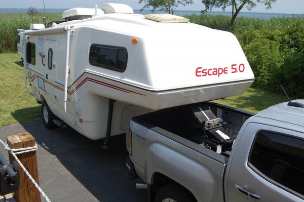 Pro Series 30056 hitch and rail package. RV5 extender on the 5.0.  Tailgate easily lowers for hitching.  Not sure if it would clear when turning.