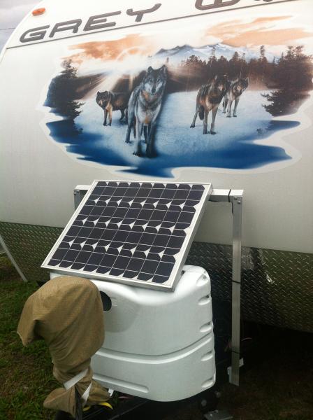 Propane Cover modded with an AL angle support frame to hold a 50 watt solar panel (charge controller is double sticked (3M automotive) under the solar