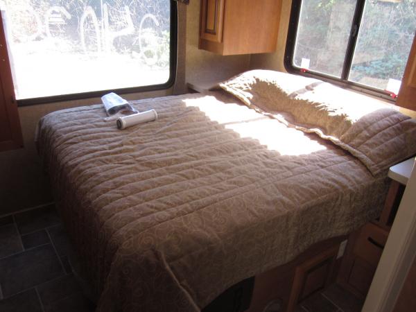 Queen Bed.  Note:  The bed is not in the slideout, the cabinets are.  Doesn't get as cold.  Bed has lots of storage under it.  Have to lift the bed up