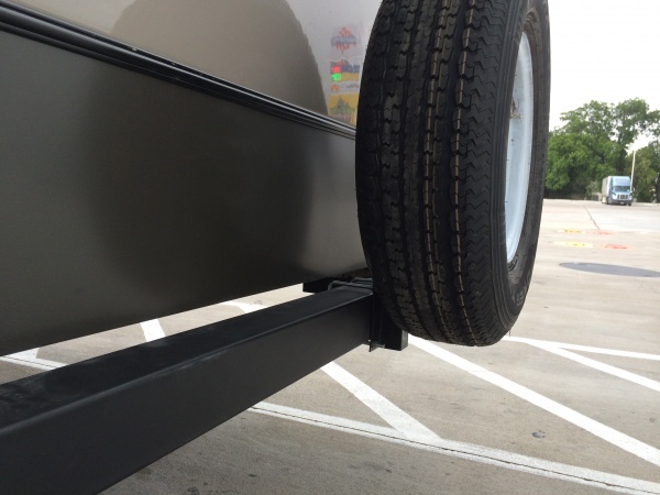 Raised spare tire mount after dragging it off.