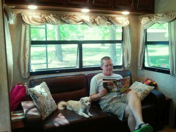 Relaxing at Omega Farms.  (the big dummy thinks he can read, LOL!)