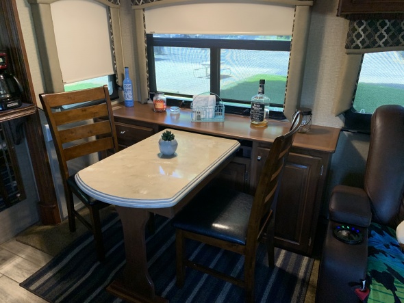 Removed Dinette and had new dinette/cabinet installed. Created a much more useable space for us. Plenty of storage in the cabinet and table slides in 