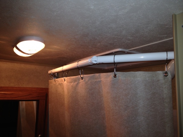 Replaced shower rod with an adjustable one, to provide more room.