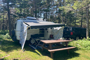 Rigged for possible rain, we can add an additional small brown tarp to the front of the awning if the wind is blowing in the wrong direction. We like 