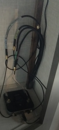 Router cabinet with connected cables to antenna