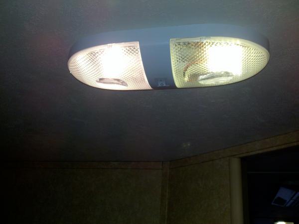 Same fixture, left original, right LED with covers on