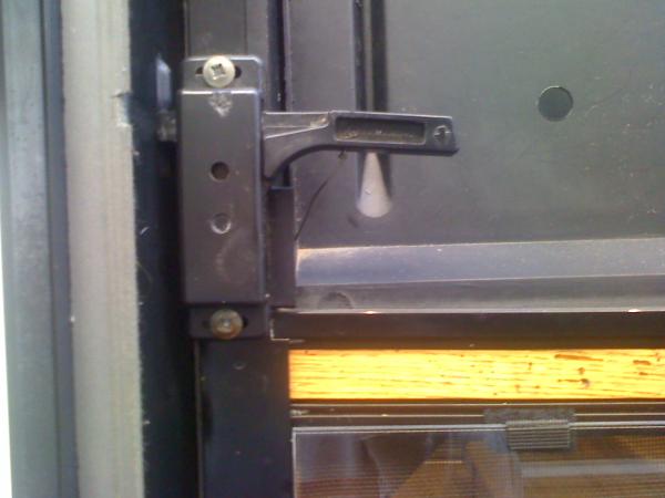 Screen door mod to open door without sliding panel all the time, Outside view of attachment point to lever