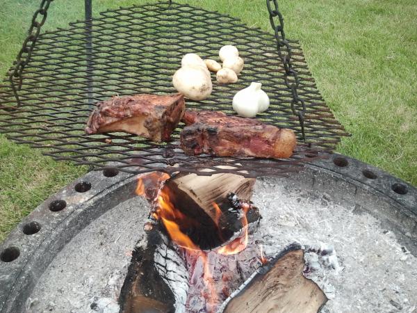 Self raised pork chops over an open fire