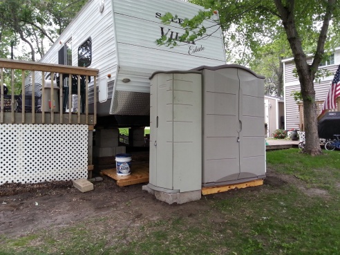 Sheds relocated to front of trailer to open up lake view from the deck.