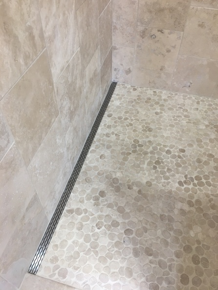 Shower floor with side drain