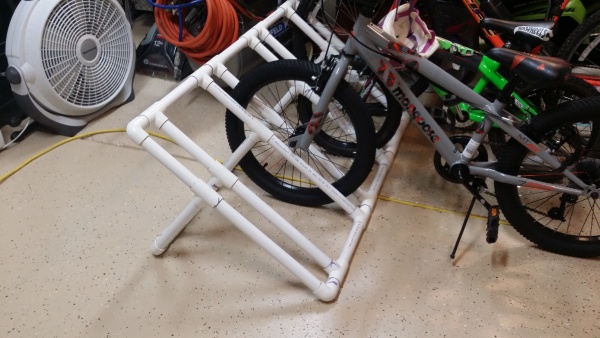 Simple PVC bicycle rack.  Plans can be found all over the internet.  Works great at campsite and allows a simple way to transport bikes in the bed of 