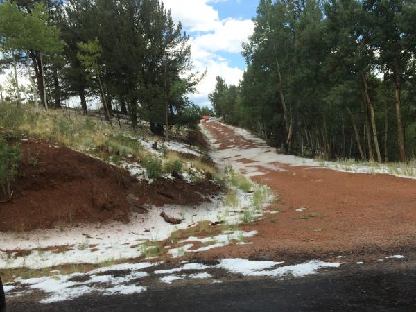 Snow alongside the road to Cripple Creek.  At first, thought it was fire retardant due to recent fires!