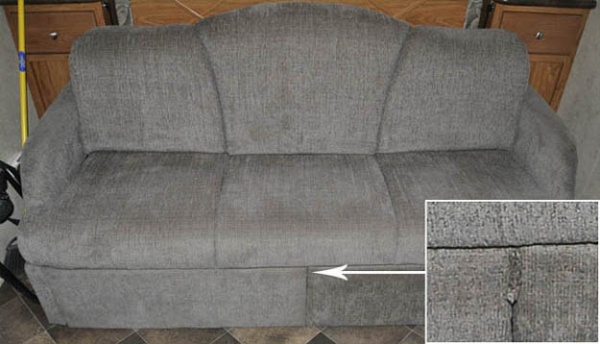 Sofa with doors closed with insert showing pull tab.