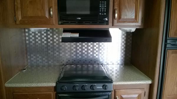 Stainless steel kitchen back splash.