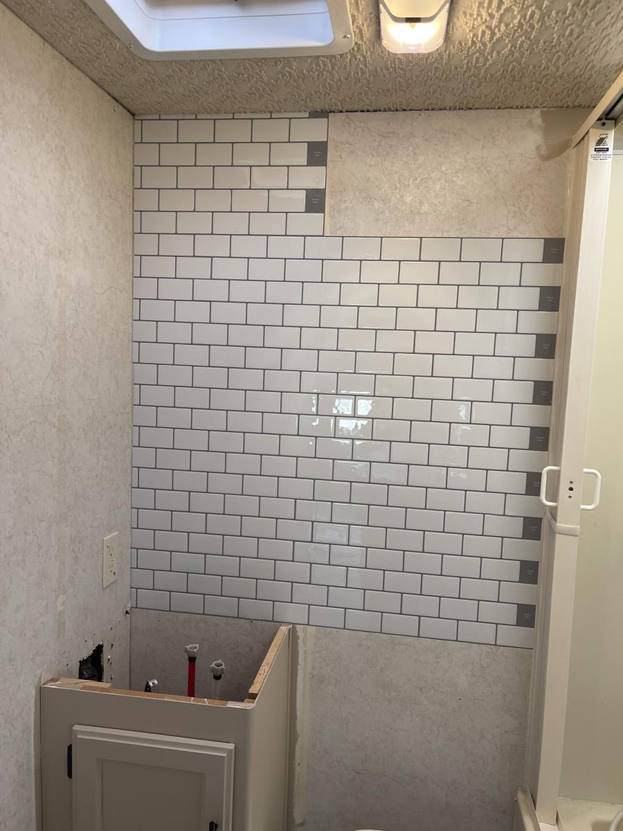 start of the subway tile in bathroom