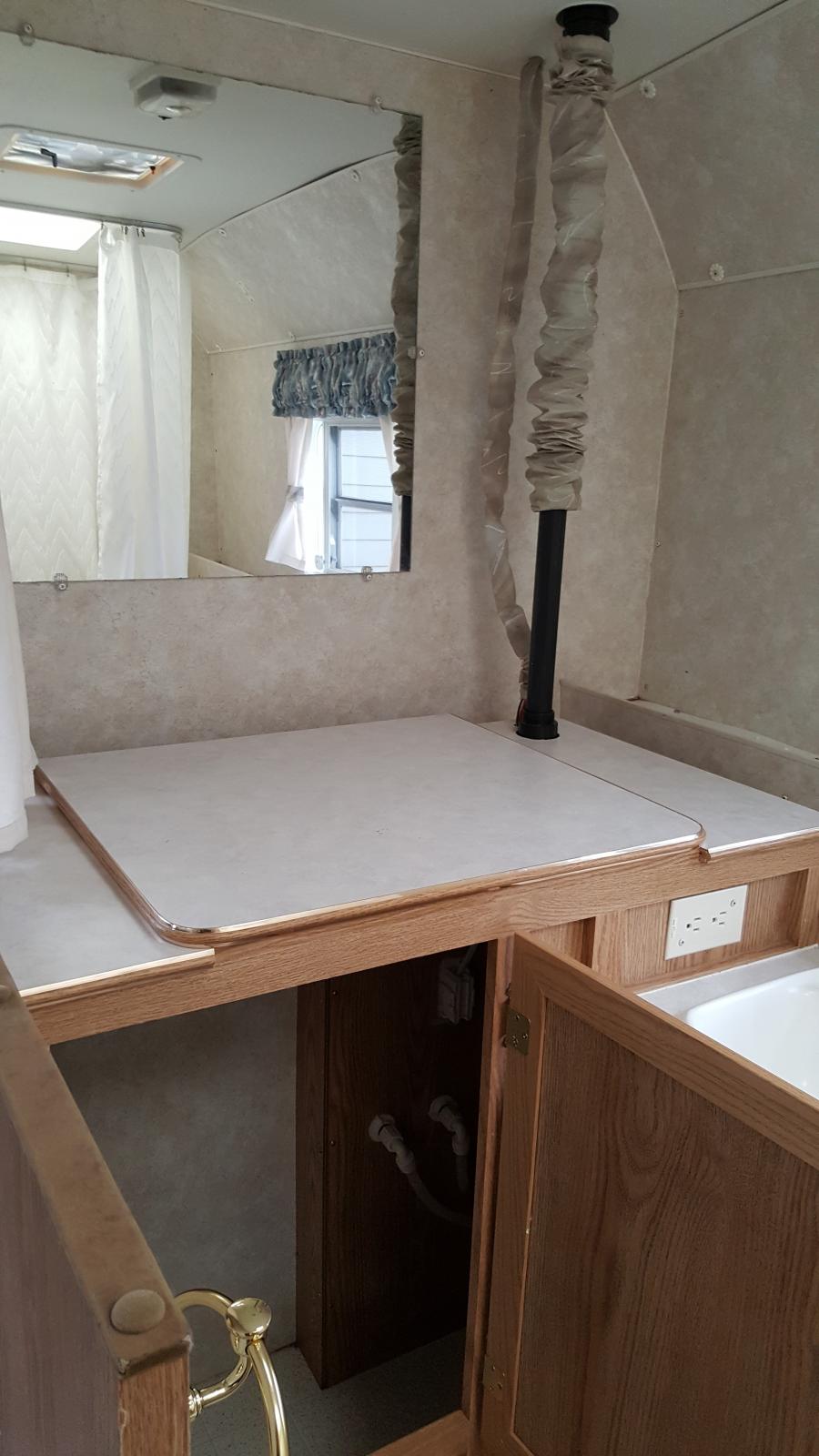 Storage cabinet and mirror in bath