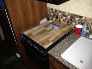 Stove top cover made from 24"x24" cutting board.